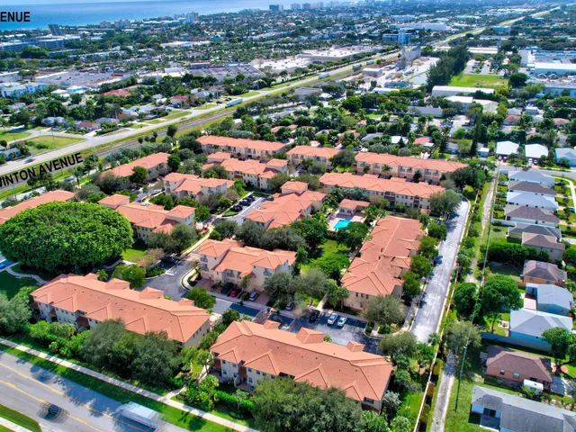 an aerial view of residential houses with outdoor space