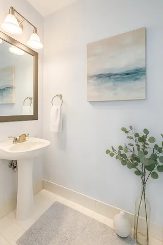 a bathroom with a sink and mirror