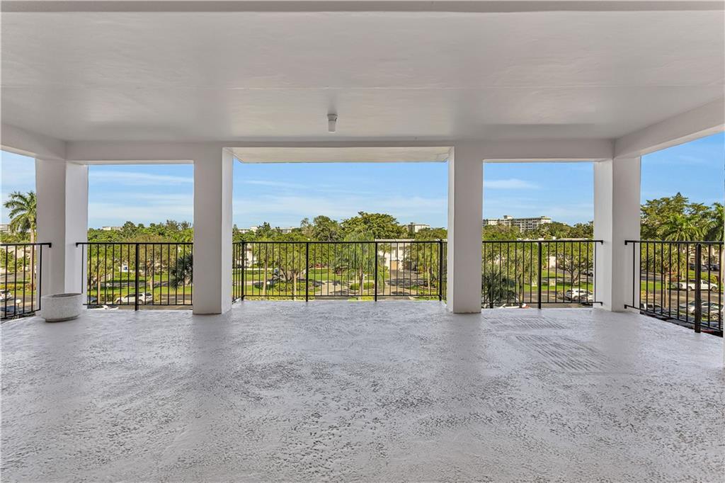 3100 North Palm Aire Drive, Unit 406 Pompano Beach, FL 33069 - Photo 12 of 16 a view of an outdoor space with a large window