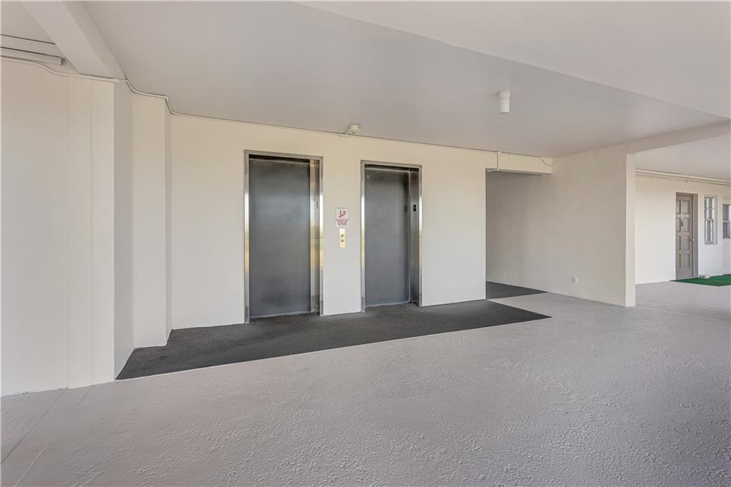 3100 North Palm Aire Drive, Unit 406 Pompano Beach, FL 33069 - Photo 13 of 16 a view of a livingroom with a staircase