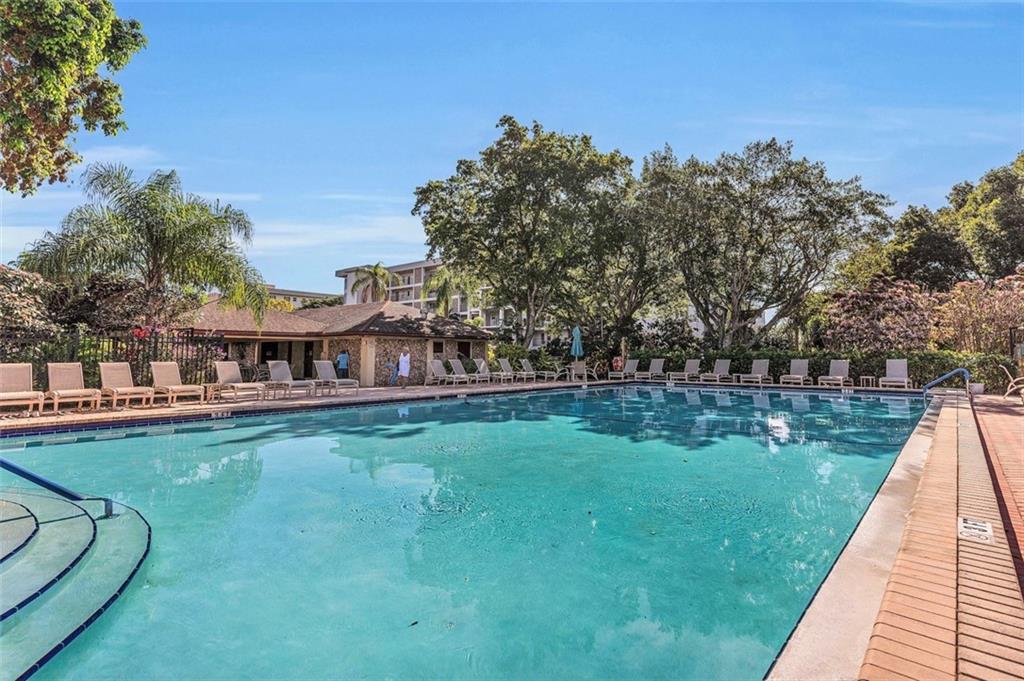 3100 North Palm Aire Drive, Unit 406 Pompano Beach, FL 33069 - Photo 15 of 16 swimming pool view with a outdoor space