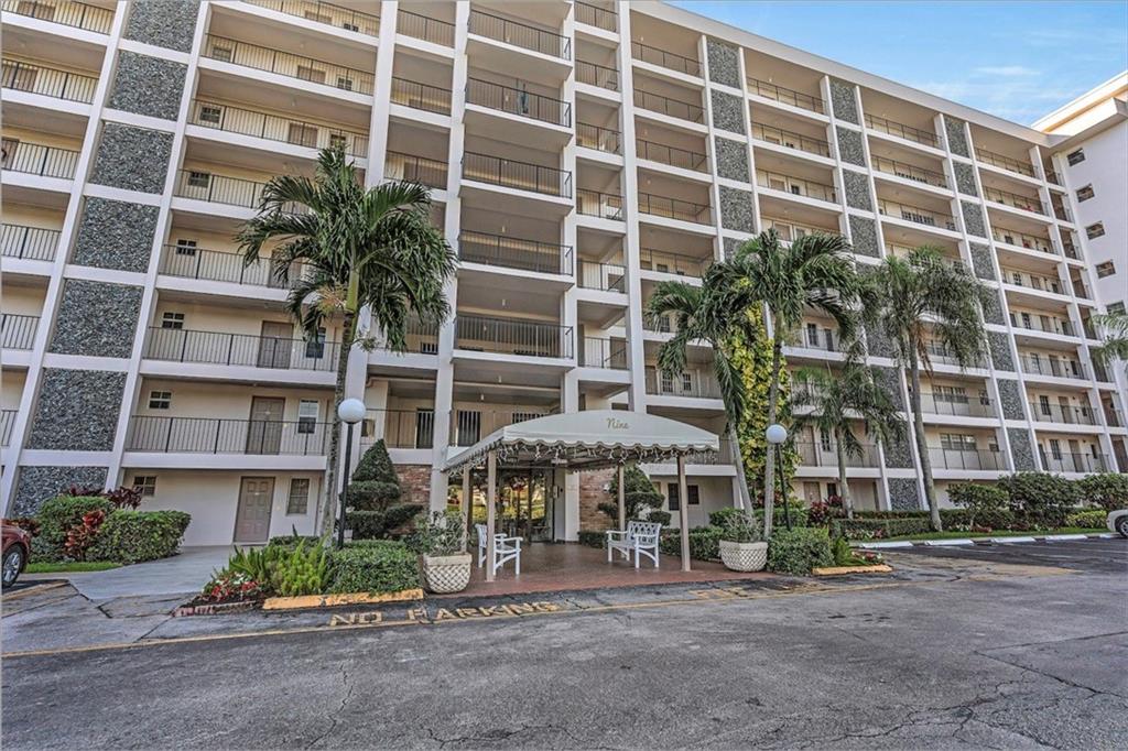 3100 North Palm Aire Drive, Unit 406 Pompano Beach, FL 33069 - Photo 16 of 16 a front view of a building