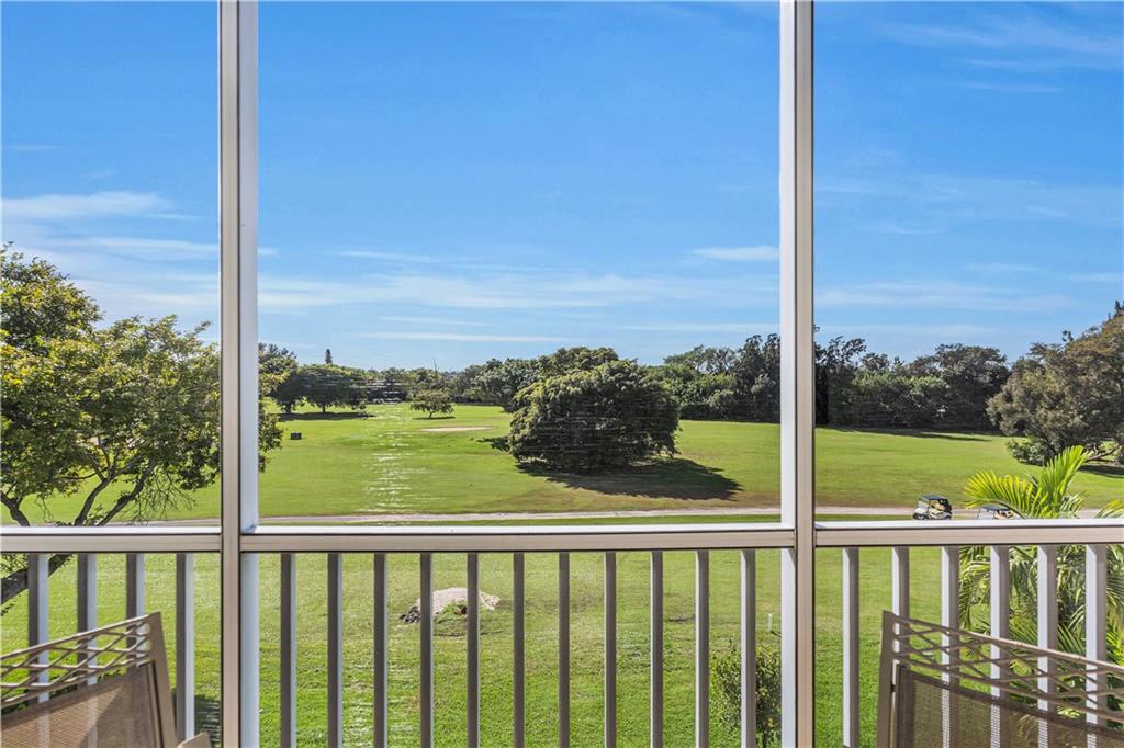 3100 North Palm Aire Drive, Unit 406 Pompano Beach, FL 33069 - Photo 2 of 16 a view of a balcony next to a yard