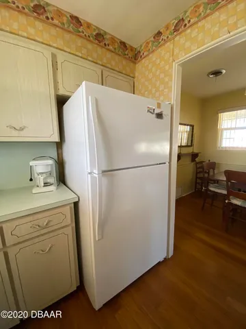a view of a kitchen with wooden floor
