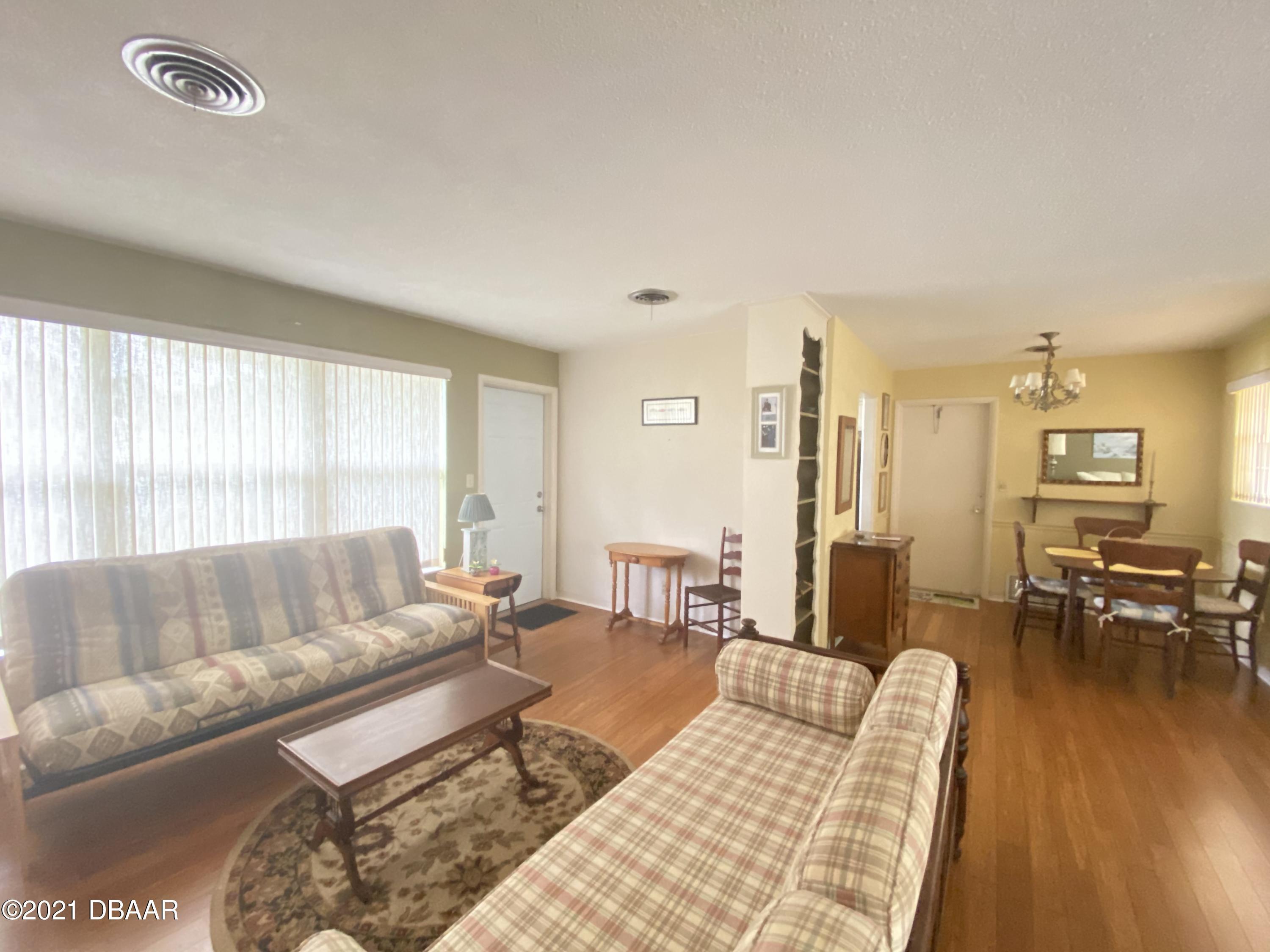 16 Silk Oaks Drive Ormond Beach, FL 32176 - Photo 19 of 37 a living room with furniture and wooden floor