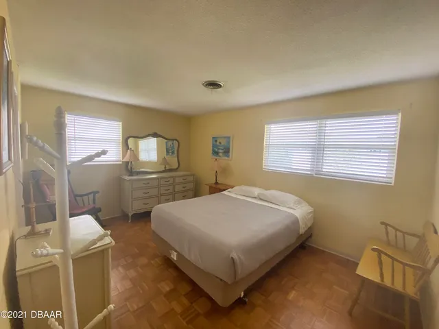 a room with a flat screen tv and cabinets