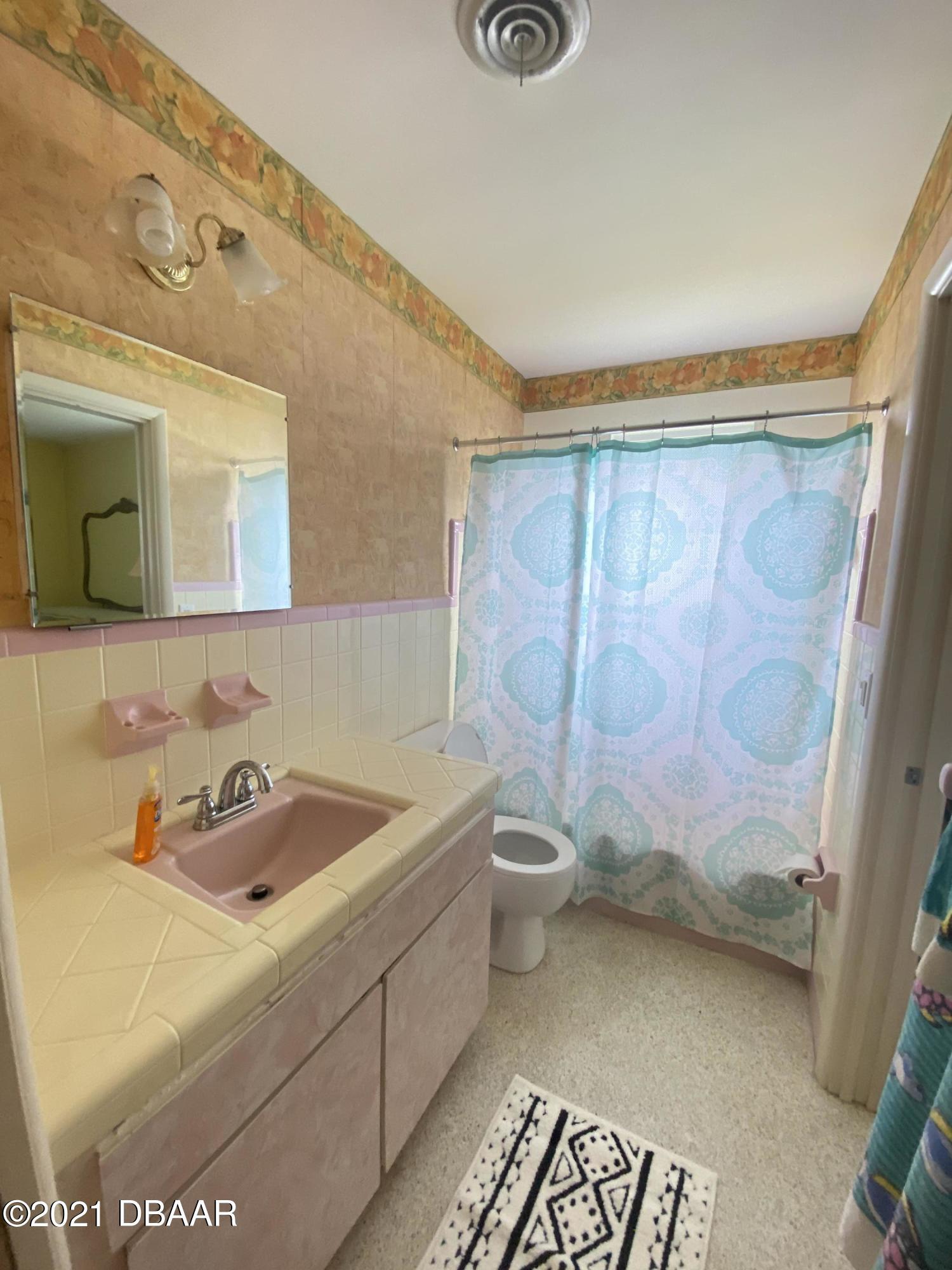 16 Silk Oaks Drive Ormond Beach, FL 32176 - Photo 24 of 37 a bathroom with a sink and a toilet