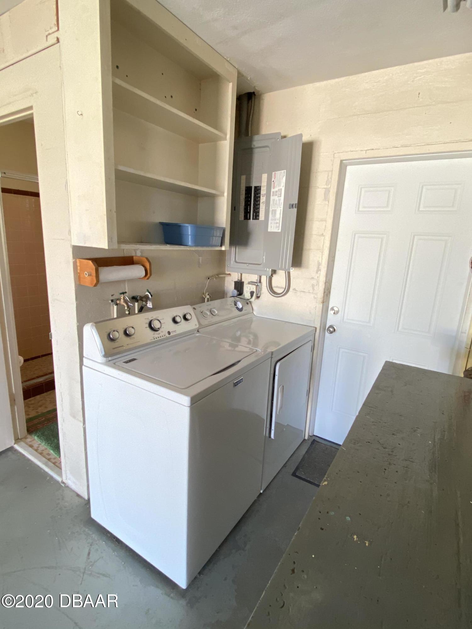 16 Silk Oaks Drive Ormond Beach, FL 32176 - Photo 30 of 37 a utility room with dryer and washer