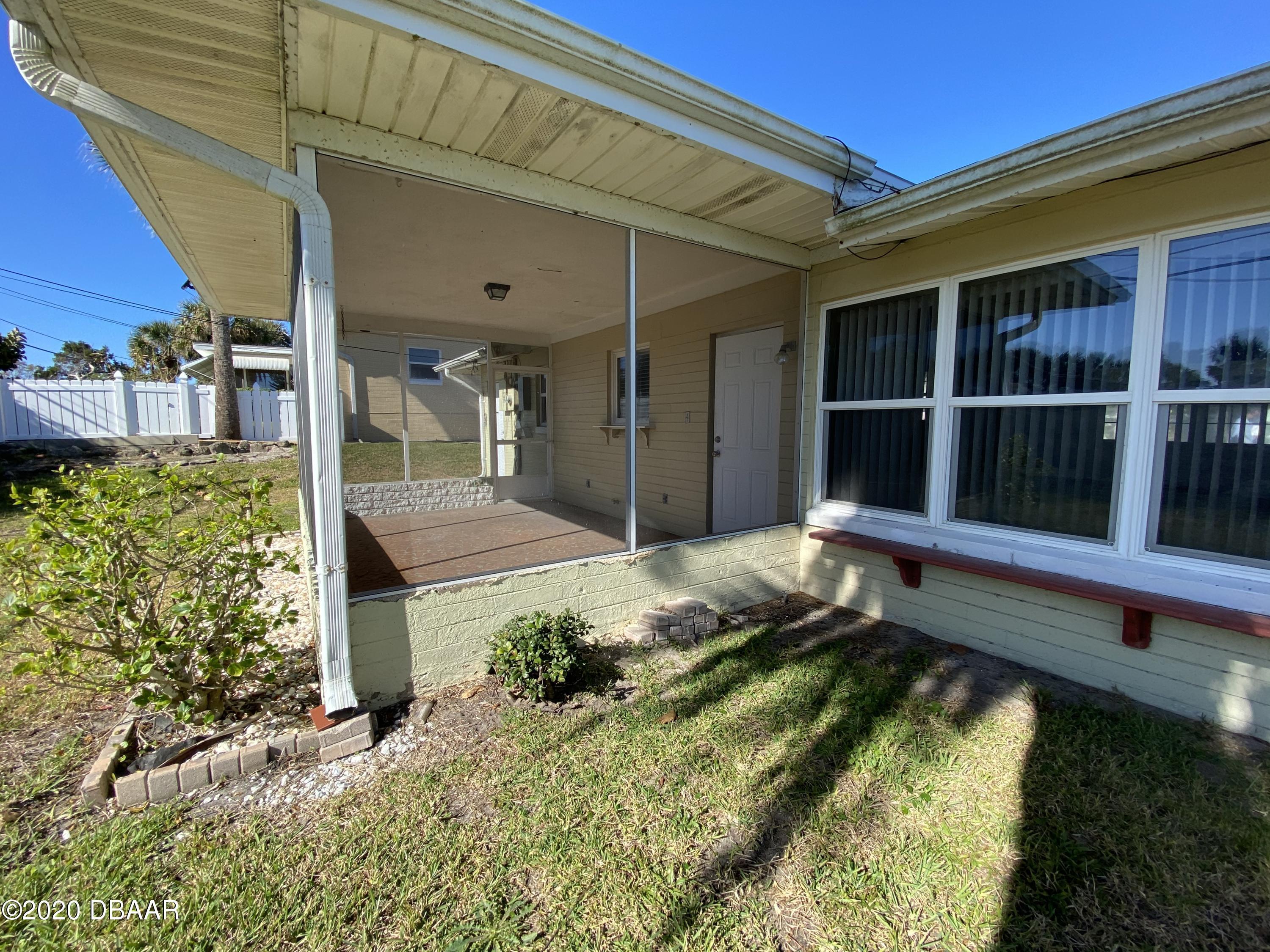 16 Silk Oaks Drive Ormond Beach, FL 32176 - Photo 34 of 37 a view of a backyard with a large tree