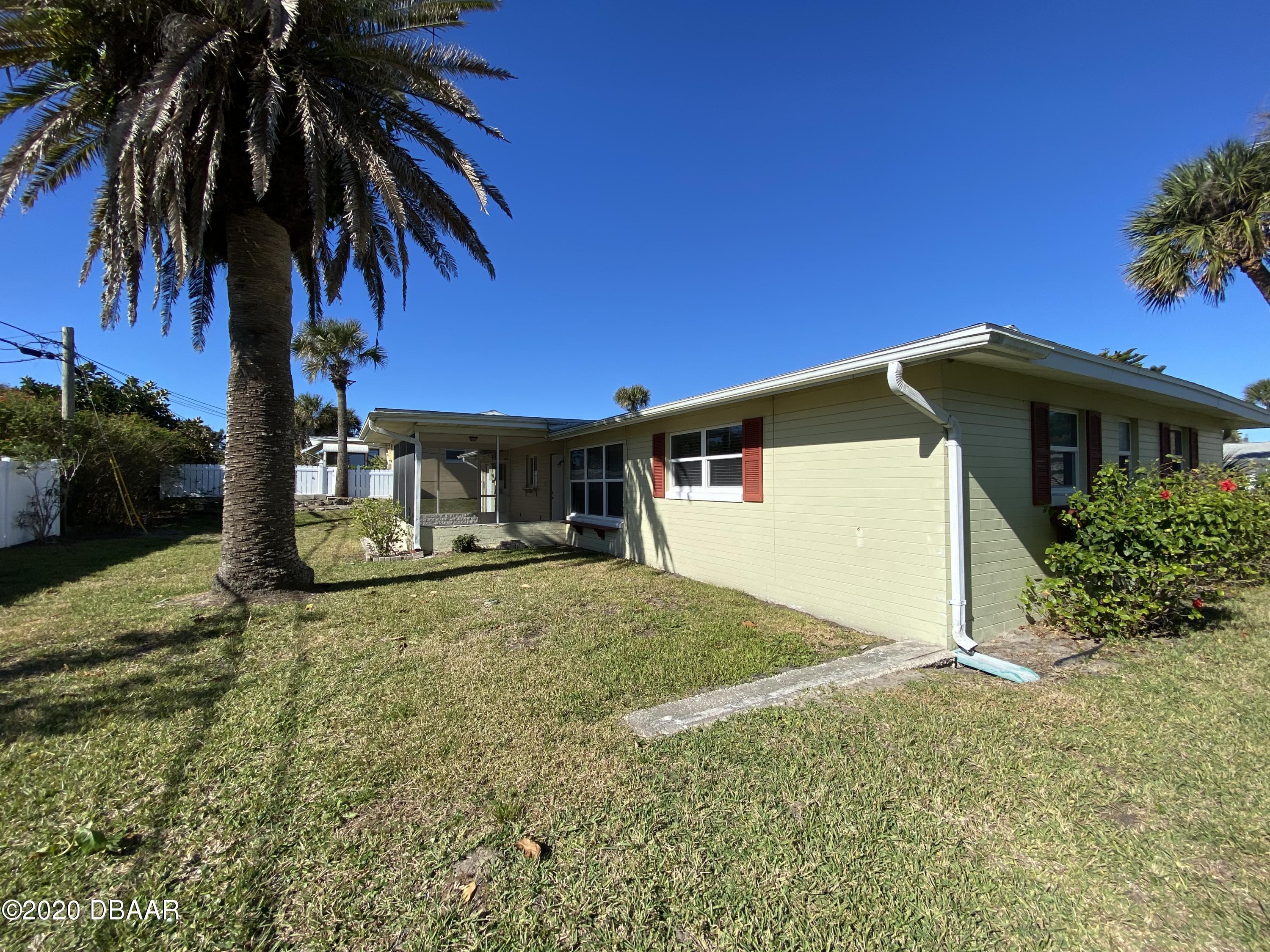 16 Silk Oaks Drive Ormond Beach, FL 32176 - Photo 36 of 37 a view of a house with a yard