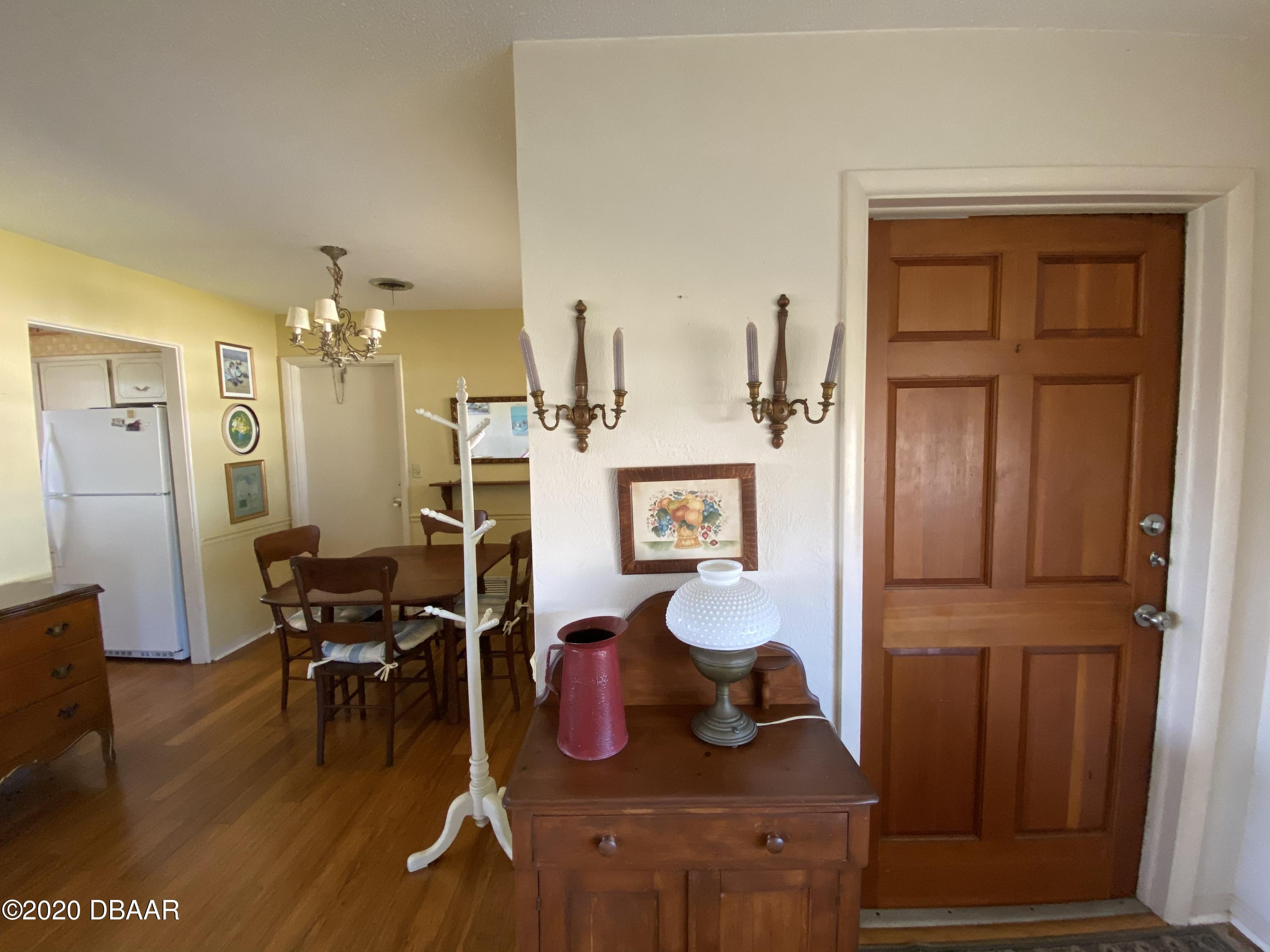 16 Silk Oaks Drive Ormond Beach, FL 32176 - Photo 9 of 37 a living room with furniture and wooden floor