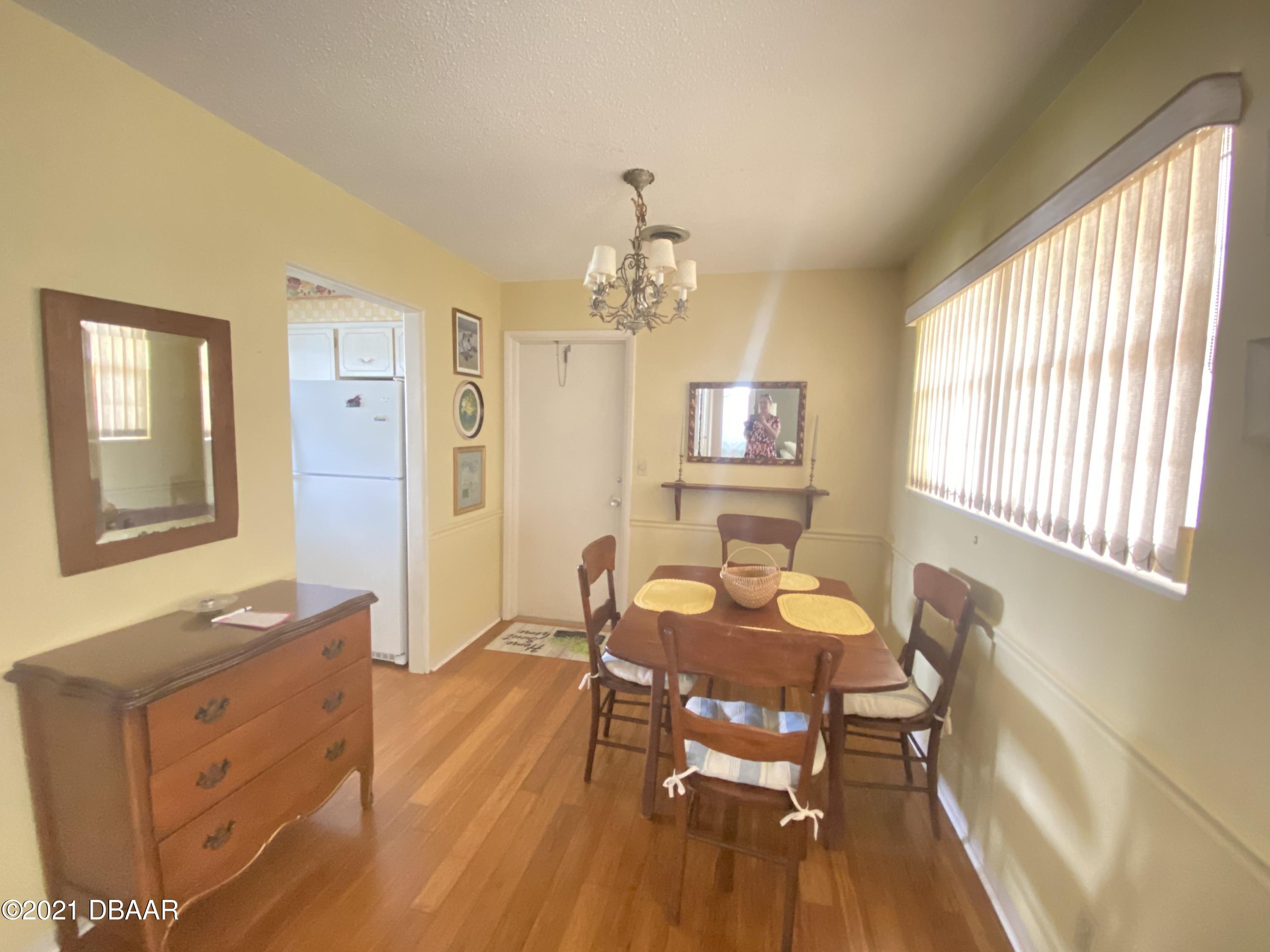 16 Silk Oaks Drive Ormond Beach, FL 32176 - Photo 10 of 37 a living room with furniture and a window
