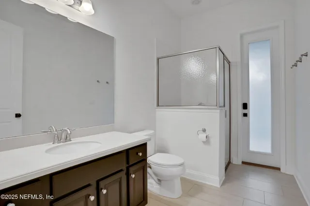 a kitchen with granite countertop a sink a stove and refrigerator