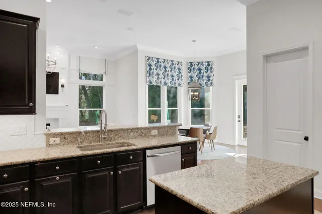 a kitchen with a stove sink and microwave