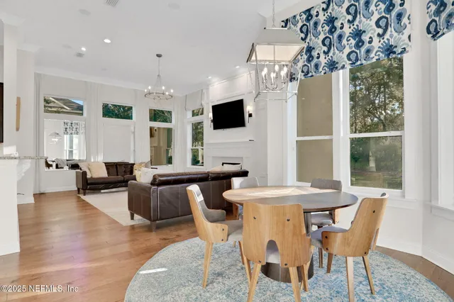 a living room with a flat screen tv and a fireplace