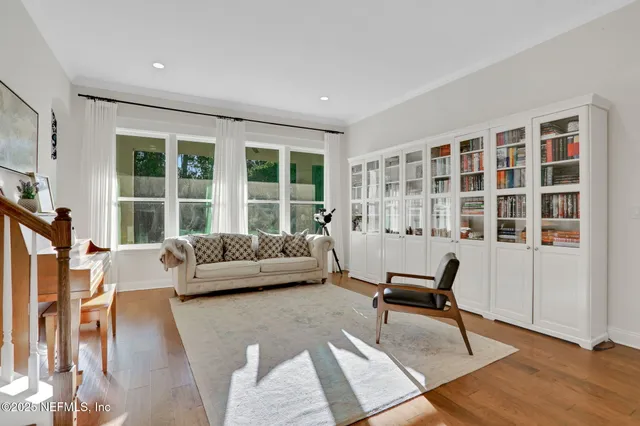 a view of a dining room with furniture and window