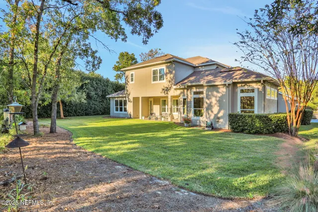 a bedroom with bed and a window