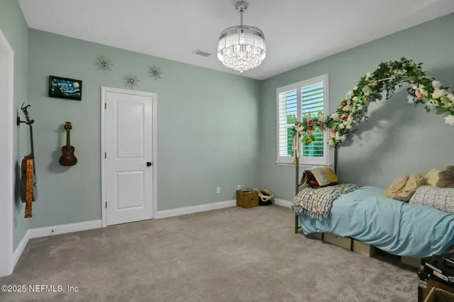 a view of a livingroom with workspace and a window