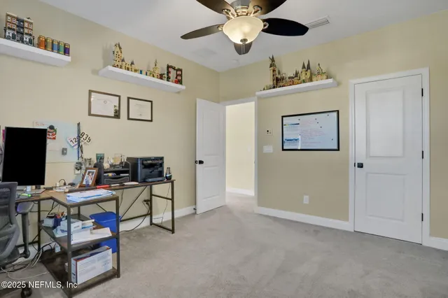a bedroom with a bed lamp and a rug