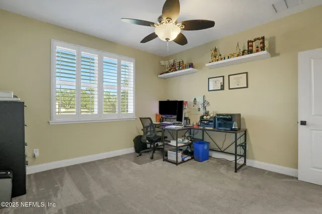 a bedroom with a bed and a book shelf