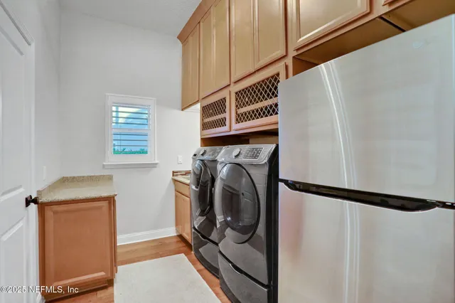 a view of park with large trees