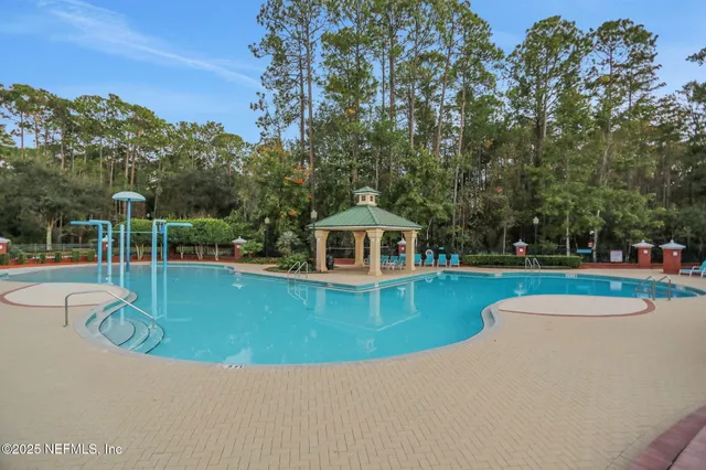 a living room with gym equipment and large window