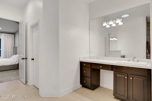 a bedroom with a large bed and a large window