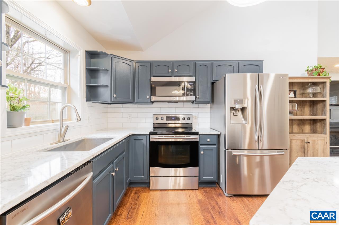 3124 Martin Kings Road Charlottesville, VA 22902 - Photo 1 of 45 a kitchen with granite countertop a refrigerator stove and sink