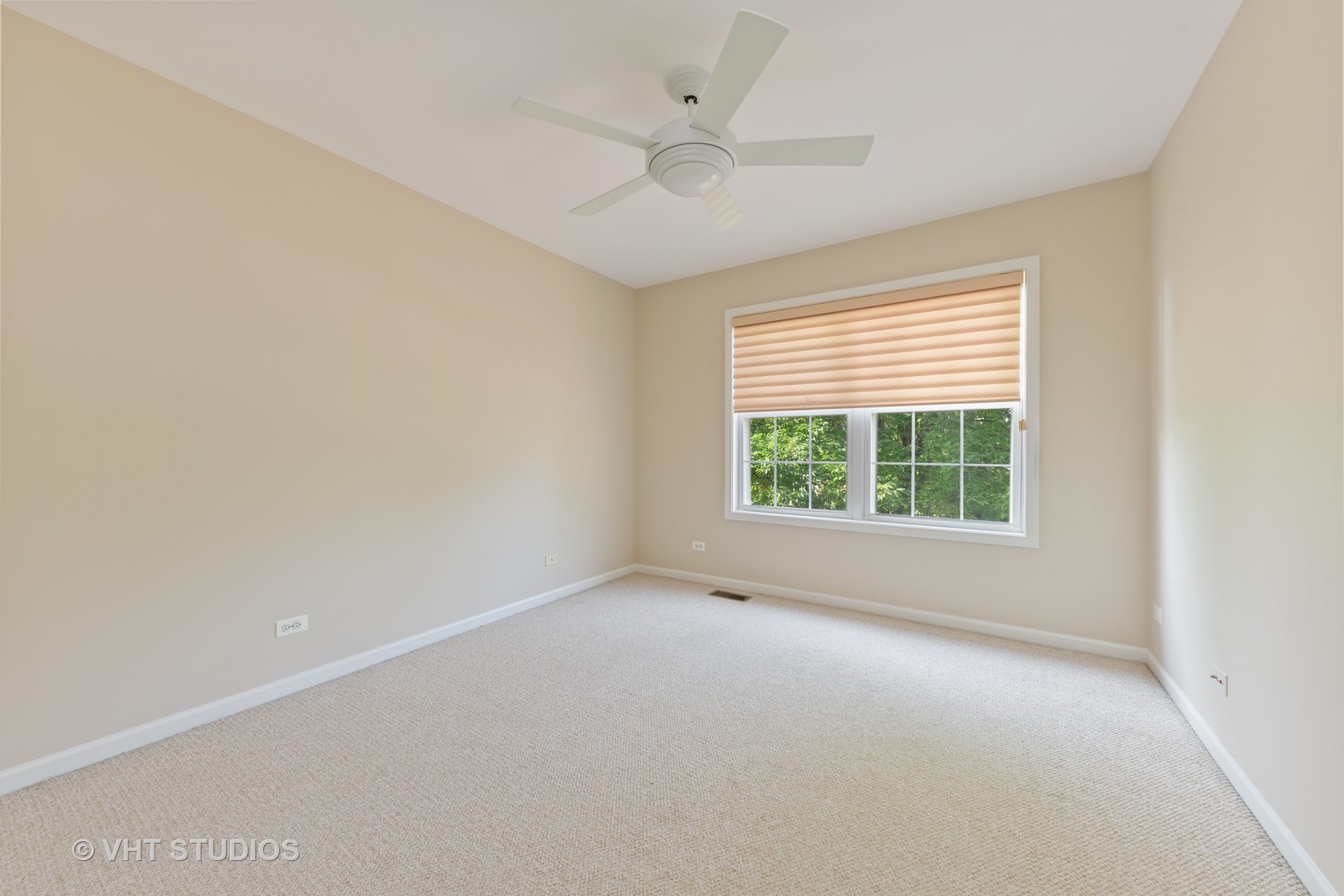 1743 Stanwich Road Vernon Hills, IL 60061 - Photo 12 of 20 an empty room with a window and a ceiling fan