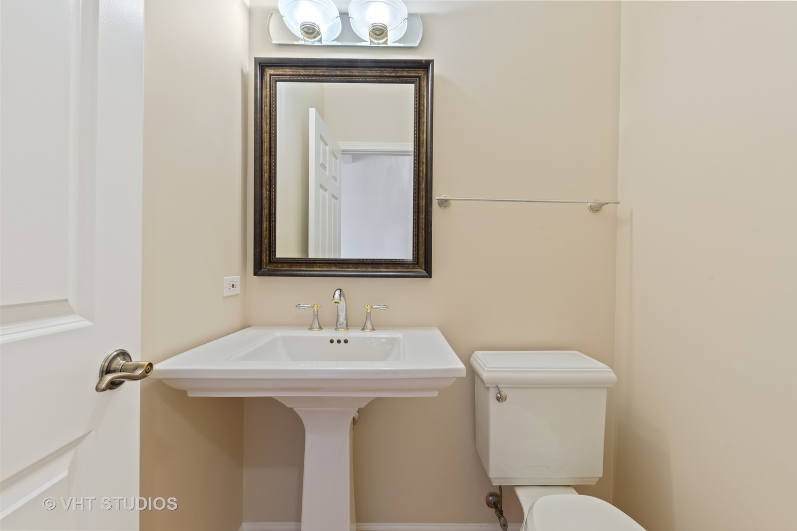 1743 Stanwich Road Vernon Hills, IL 60061 - Photo 15 of 20 a bathroom with a toilet sink and mirror