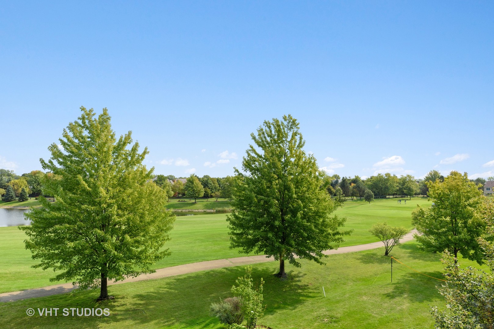 1743 Stanwich Road Vernon Hills, IL 60061 - Photo 18 of 20 a view of a lake with a yard