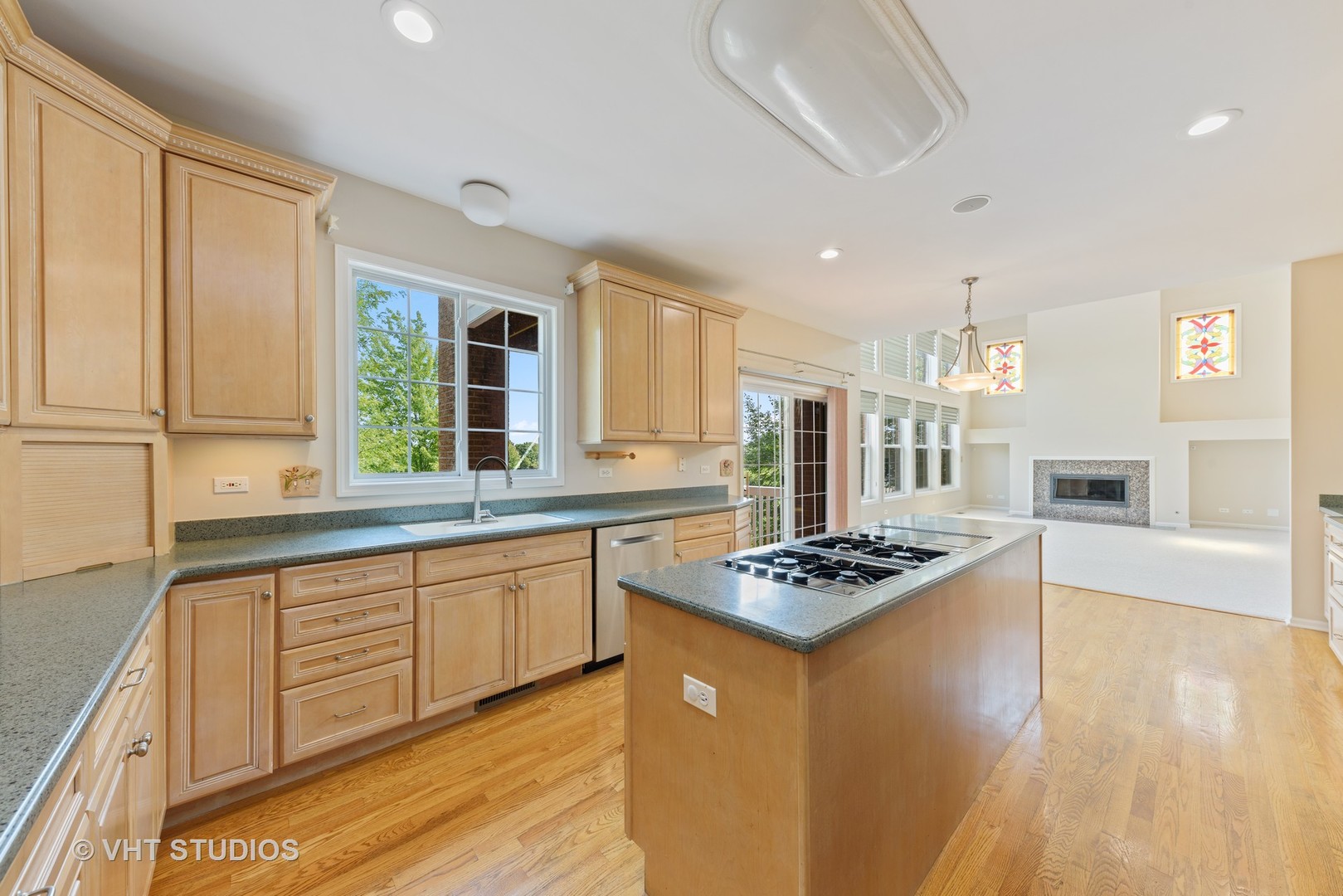 1743 Stanwich Road Vernon Hills, IL 60061 - Photo 4 of 20 a kitchen with stainless steel appliances kitchen island granite countertop a stove a sink dishwasher and white cabinets with wooden floor