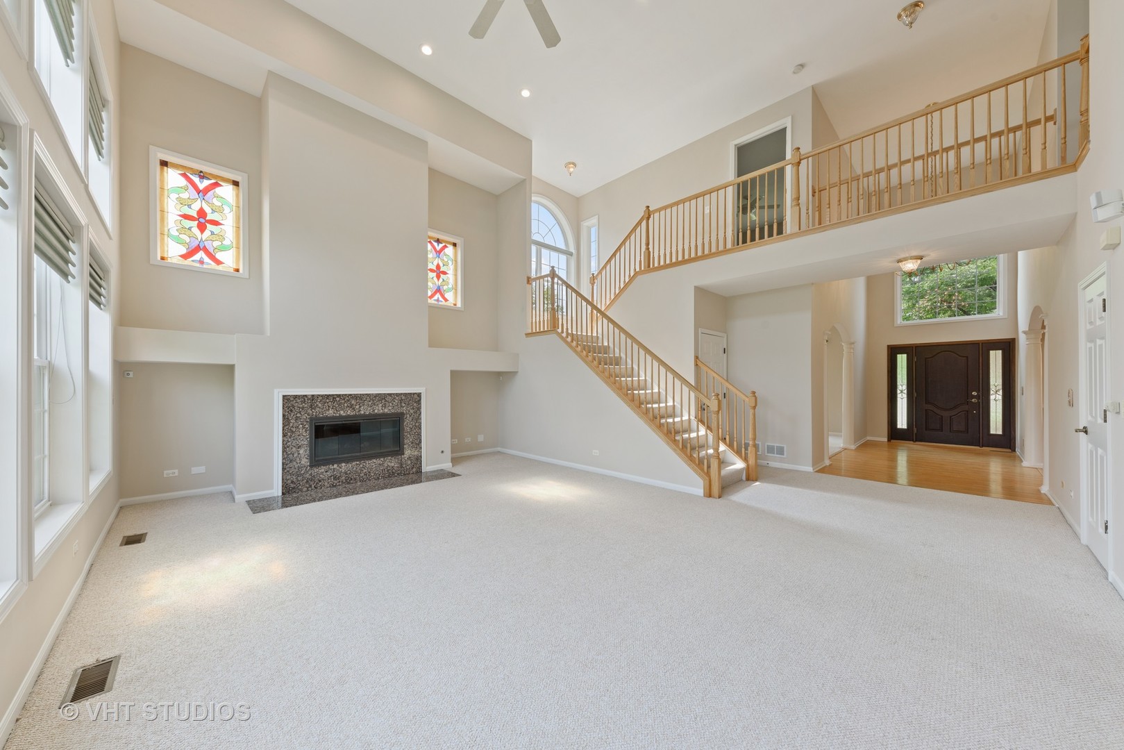 1743 Stanwich Road Vernon Hills, IL 60061 - Photo 7 of 20 a view of an empty room with a fireplace and a window