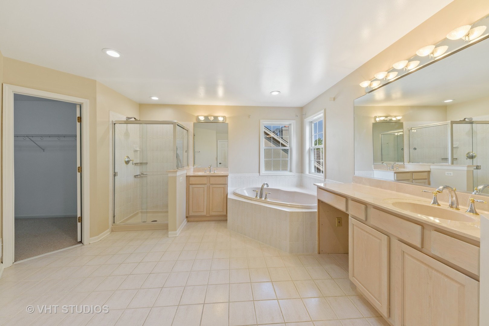 1743 Stanwich Road Vernon Hills, IL 60061 - Photo 10 of 20 a large bathroom with a large mirror vanity and a shower