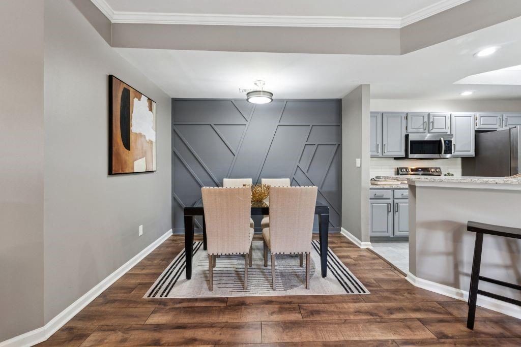 1037 McGill Park Avenue Northeast Atlanta, GA 30312 - Photo 12 of 46 a dining room with furniture and window