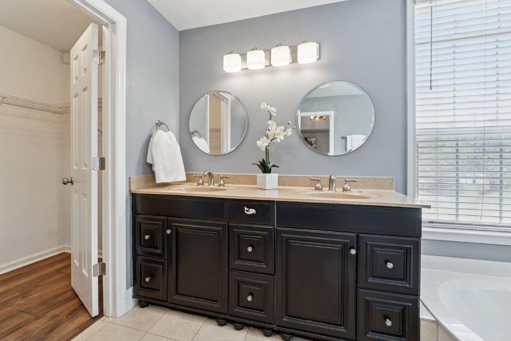 1037 McGill Park Avenue Northeast Atlanta, GA 30312 - Photo 25 of 46 a bathroom with a sink and a mirror