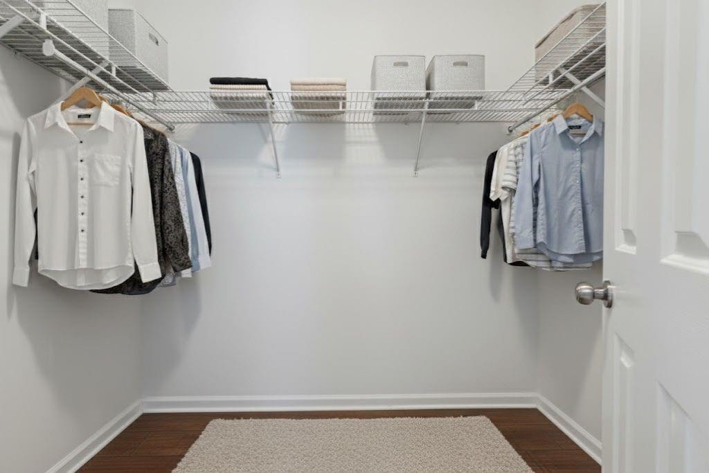 1037 McGill Park Avenue Northeast Atlanta, GA 30312 - Photo 27 of 46 a view of walk in closet with clothes and shoes