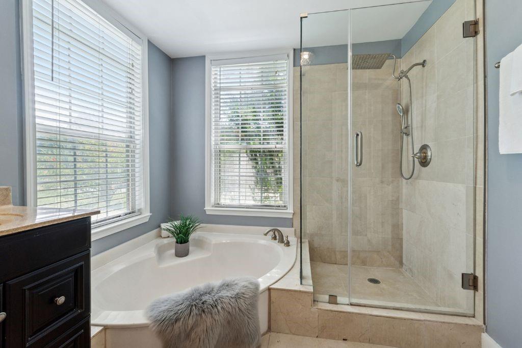 1037 McGill Park Avenue Northeast Atlanta, GA 30312 - Photo 29 of 46 a bath room with a bath tub and a shower