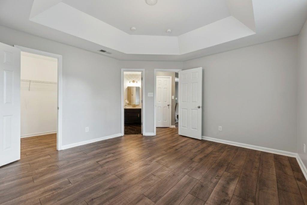 1037 McGill Park Avenue Northeast Atlanta, GA 30312 - Photo 35 of 46 a view of an empty room with wooden floor and a window