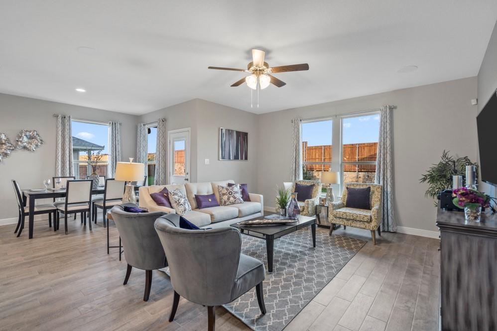 105 Ringtail Drive Rhome, TX 76078 - Photo 14 of 40 a living room with furniture dining table and a potted plant