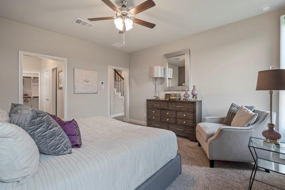 105 Ringtail Drive Rhome, TX 76078 - Photo 18 of 40 a bedroom with a bed and furniture
