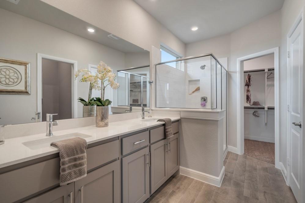 105 Ringtail Drive Rhome, TX 76078 - Photo 21 of 40 a bathroom with a double vanity sink mirror and double
