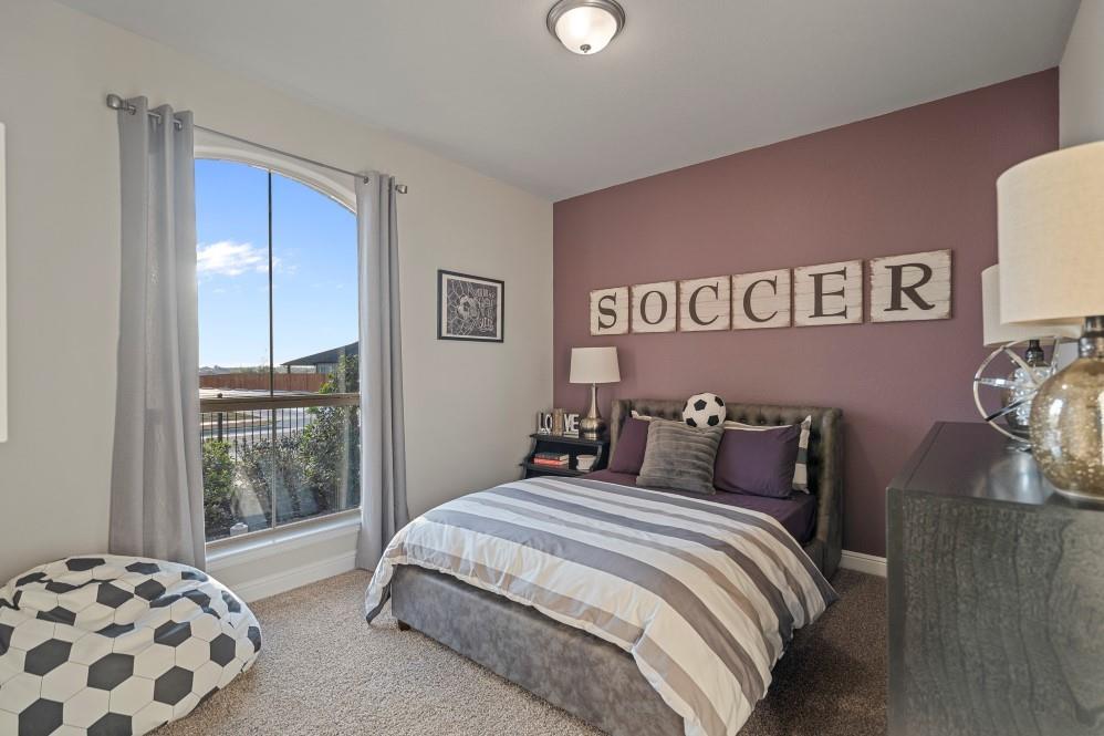 105 Ringtail Drive Rhome, TX 76078 - Photo 23 of 40 a bedroom with a large bed and a window
