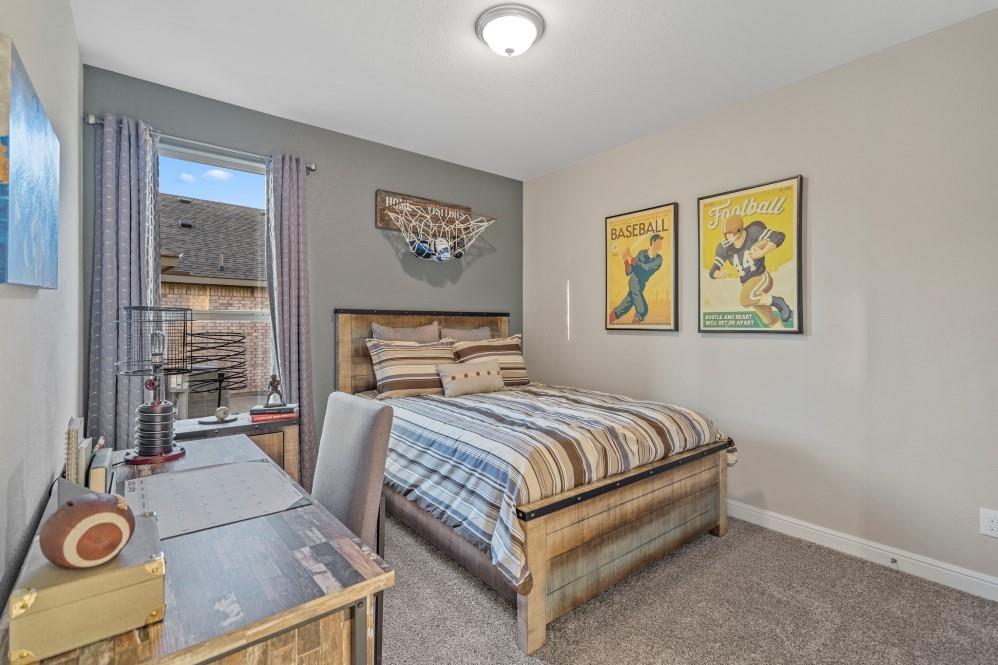 105 Ringtail Drive Rhome, TX 76078 - Photo 29 of 40 a bedroom with a bed and a window