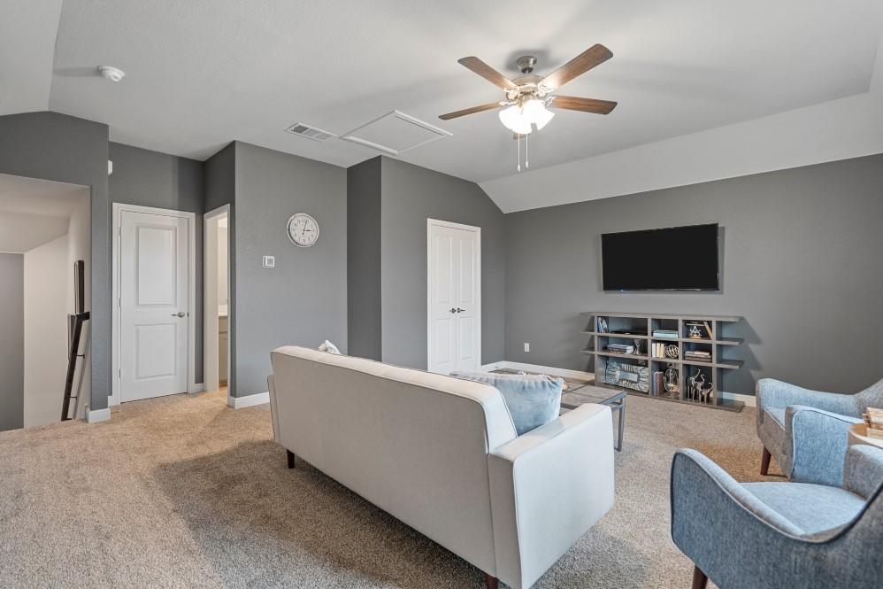 105 Ringtail Drive Rhome, TX 76078 - Photo 33 of 40 a living room with furniture and a flat screen tv