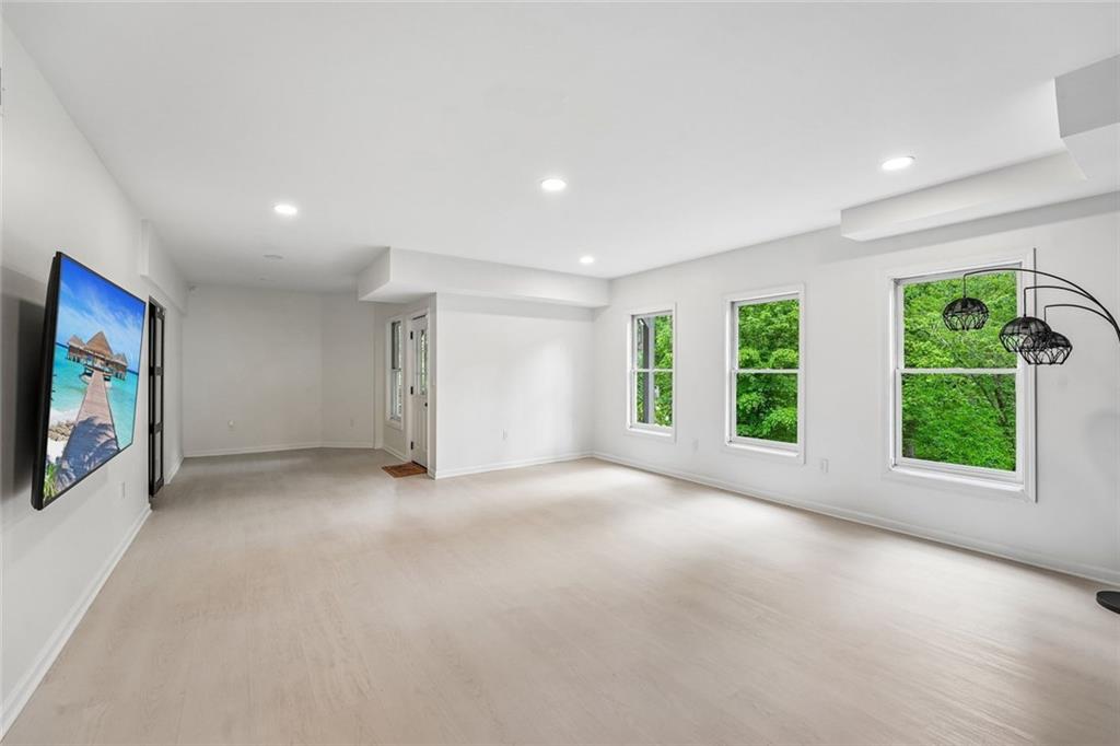 1091 Fieldstone Trail Milton, GA 30004 - Photo 49 of 84 a view of a livingroom with an empty space and a window