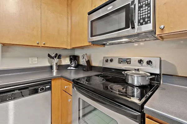 a kitchen with a stove and a microwave