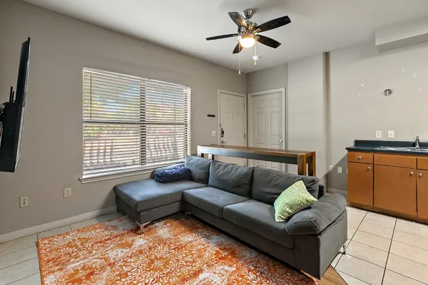 a living room with furniture and a window