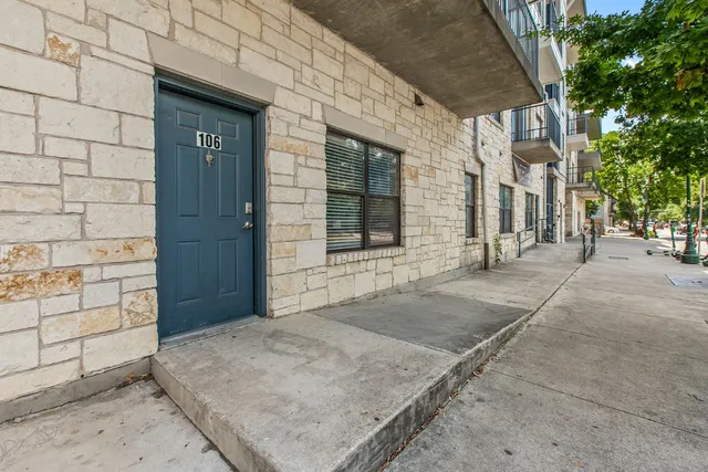 a kitchen with stainless steel appliances granite countertop a refrigerator a stove a sink and a microwave