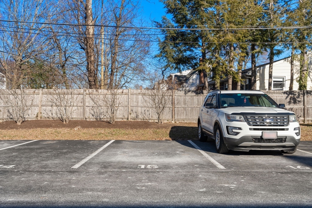 32 Whitman Road, Unit 14 Waltham, MA 02453 - Photo 16 of 20 a car parked on the side of a road